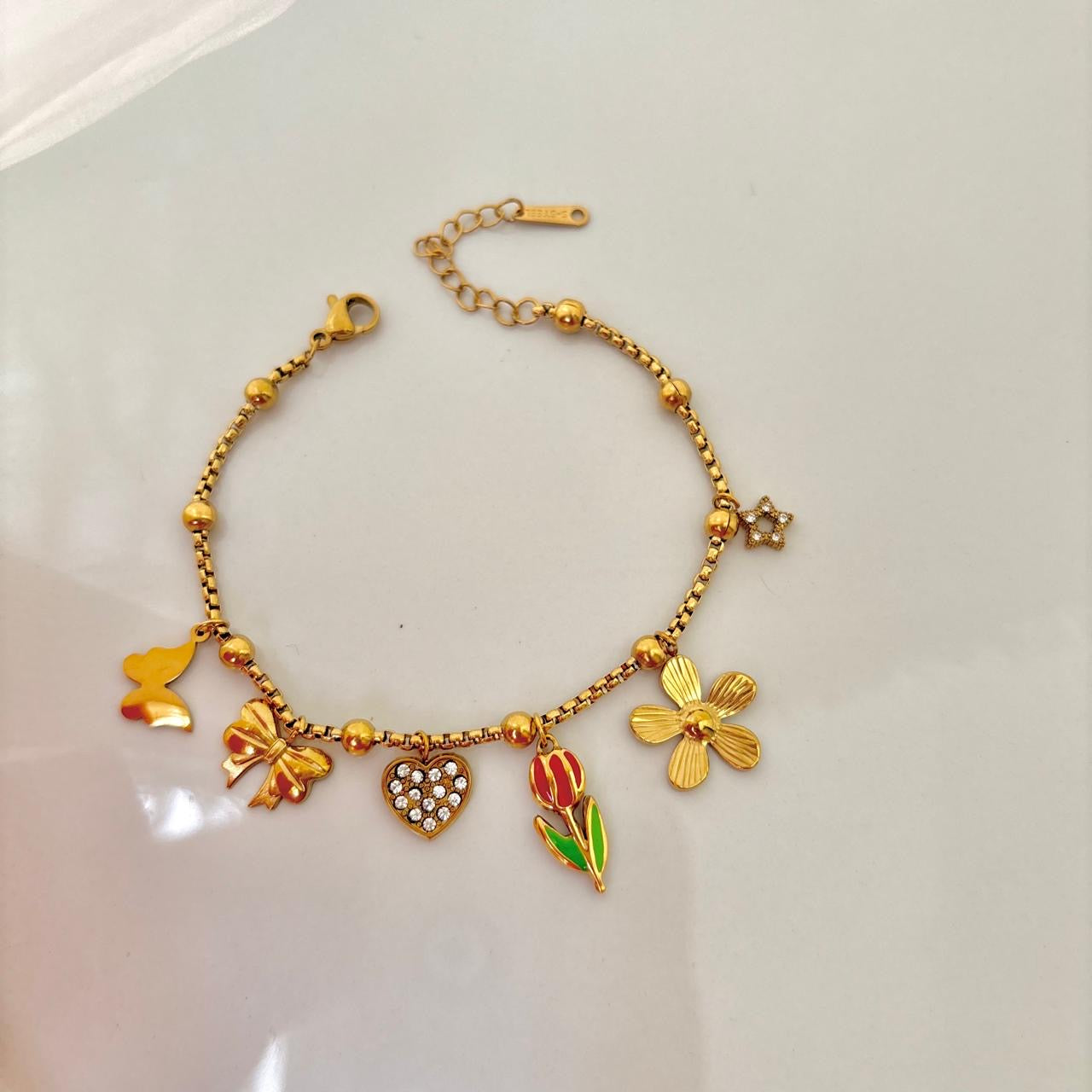 Whimsy Bloom & Bow Charms Bracelet